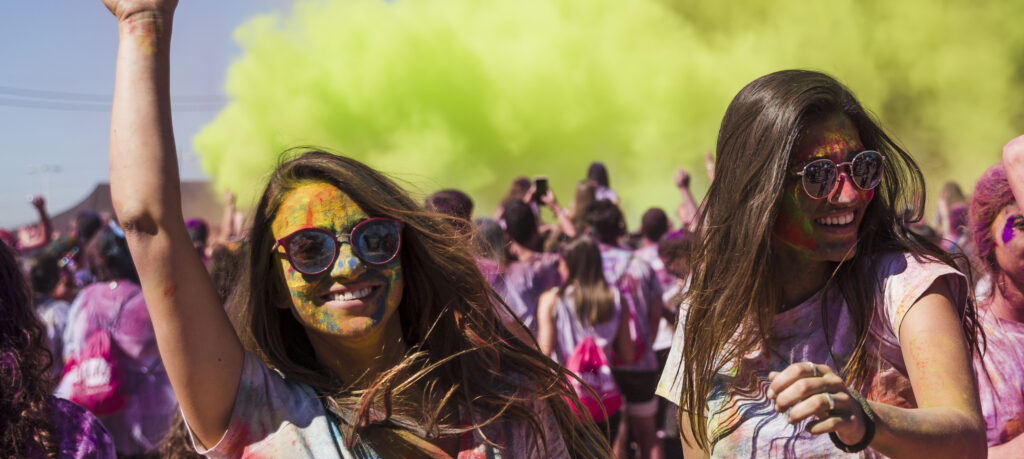 Smiling Women at a Holi Event