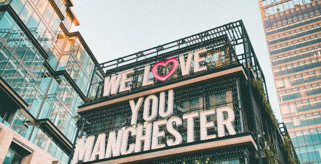 Wir lieben dich, Manchester-Schild