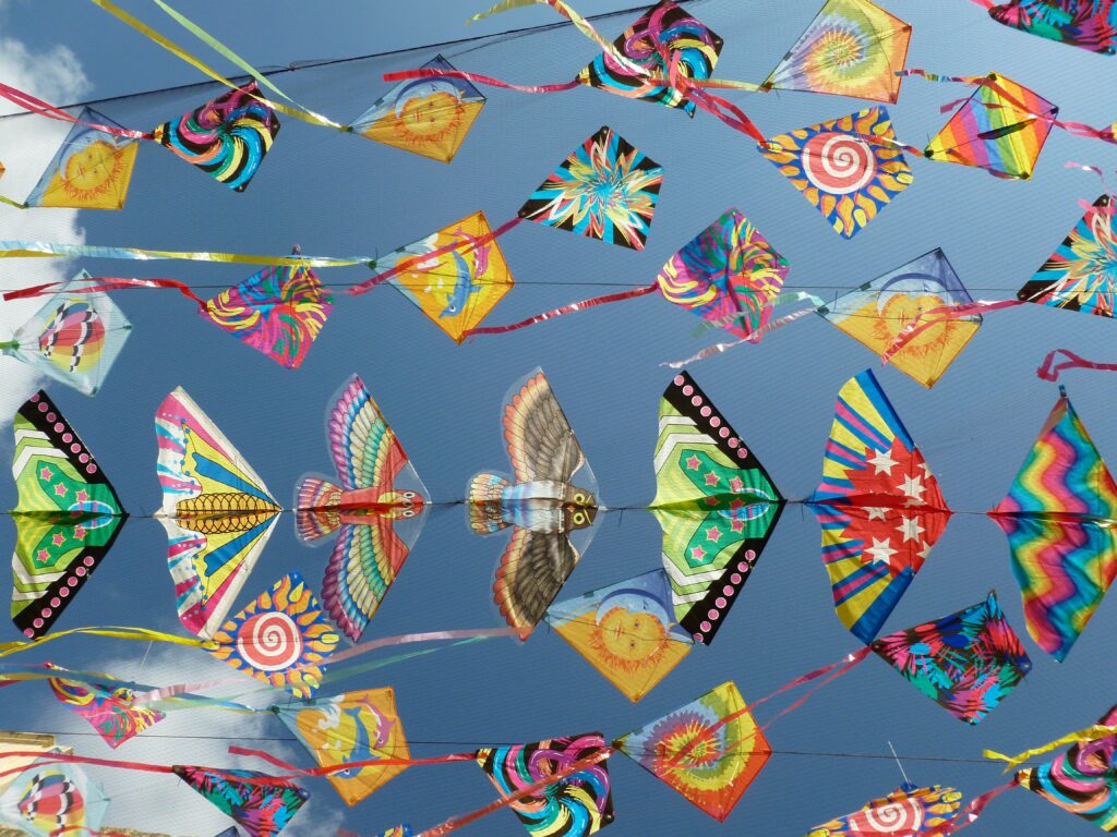 Kites Flying in the Air at a Festival